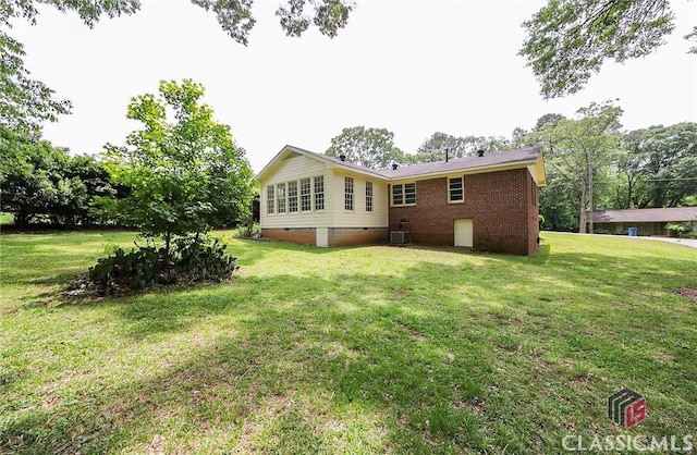120 Hunt Rd, Athens, GA 30606 - rear view of house featuring a lawn, central air condition unit, and crawl space