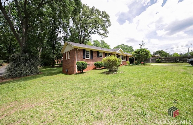 120 Hunt Rd, Athens, GA 30606 - view of front facade featuring brick siding, fence, and a front yard