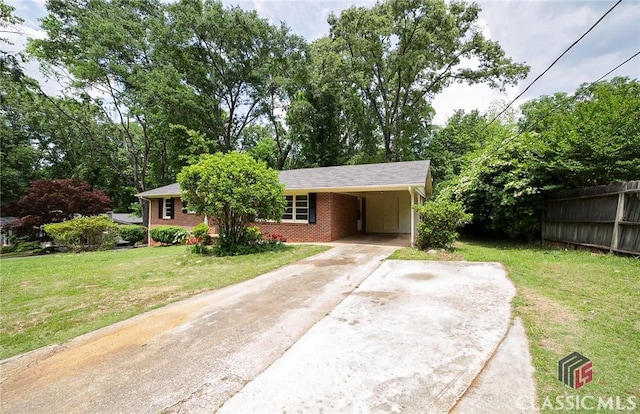 120 Hunt Rd, Athens, GA 30606 - view of front of property with fence, a front lawn, brick siding, an attached carport, and concrete driveway