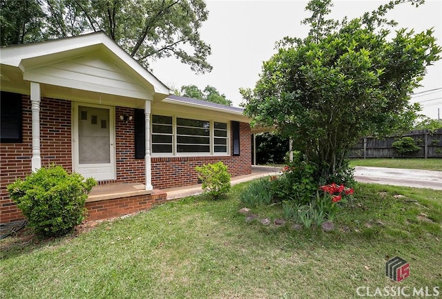 120 Hunt Rd, Athens, GA 30606 - view of front of house featuring brick siding, a front lawn, and fence