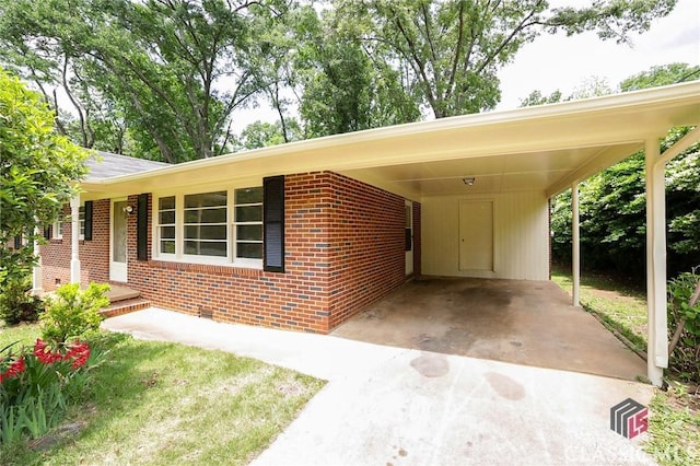 120 Hunt Rd, Athens, GA 30606 - view of front facade featuring brick siding, an attached carport, and concrete driveway