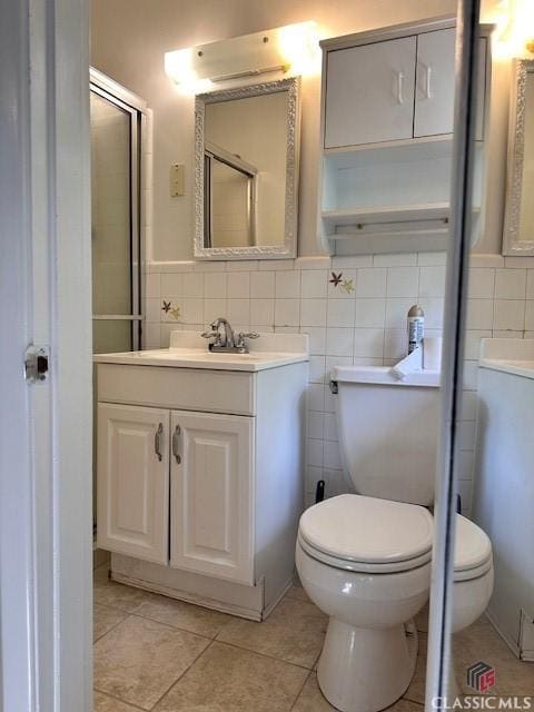 735 Timothy Rd, Athens, GA 30606 - full bathroom featuring toilet, tile walls, tile patterned flooring, and vanity