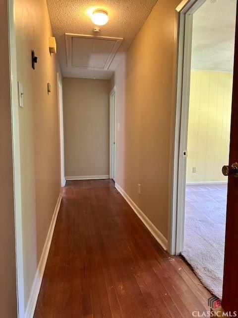 735 Timothy Rd, Athens, GA 30606 - corridor with attic access, a textured ceiling, and hardwood / wood-style flooring