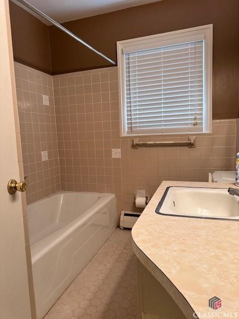 735 Timothy Rd, Athens, GA 30606 - bathroom featuring tile patterned floors, tile walls, vanity, and baseboard heating