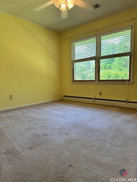 735 Timothy Rd, Athens, GA 30606 - empty room with a baseboard heating unit, a textured ceiling, visible vents, ceiling fan, and carpet flooring