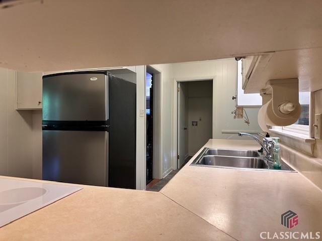 735 Timothy Rd, Athens, GA 30606 - kitchen featuring freestanding refrigerator, light countertops, and a sink