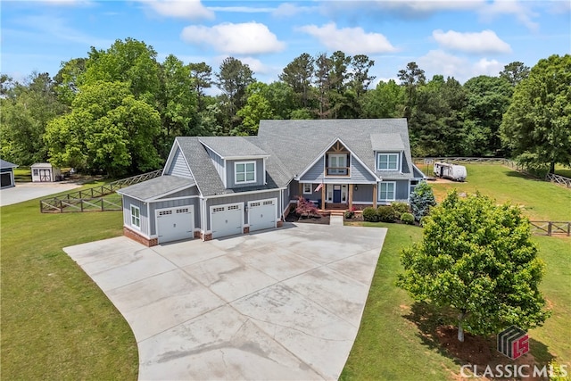 view of front of house featuring concrete driveway, board and batten siding, roof with shingles, and a front lawn