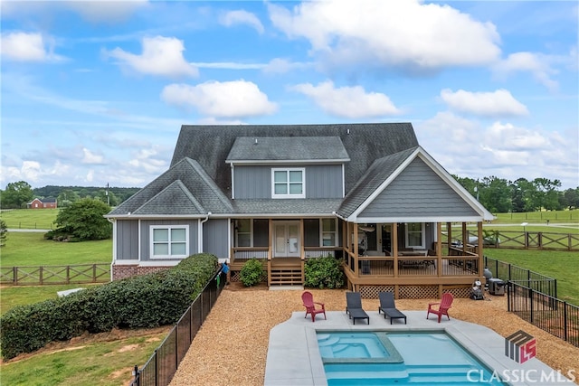 back of property featuring a fenced backyard, a lawn, a fenced in pool, and board and batten siding