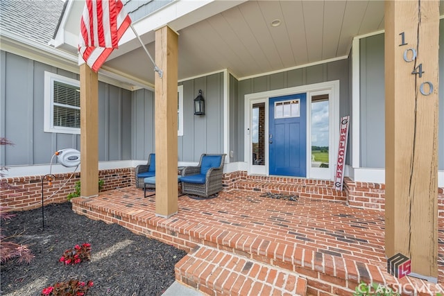 property entrance with a porch and board and batten siding