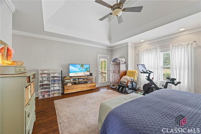 bedroom featuring a tray ceiling, ornamental molding, access to outside, and dark wood-type flooring