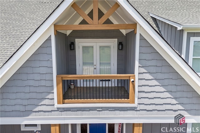 exterior details with roof with shingles