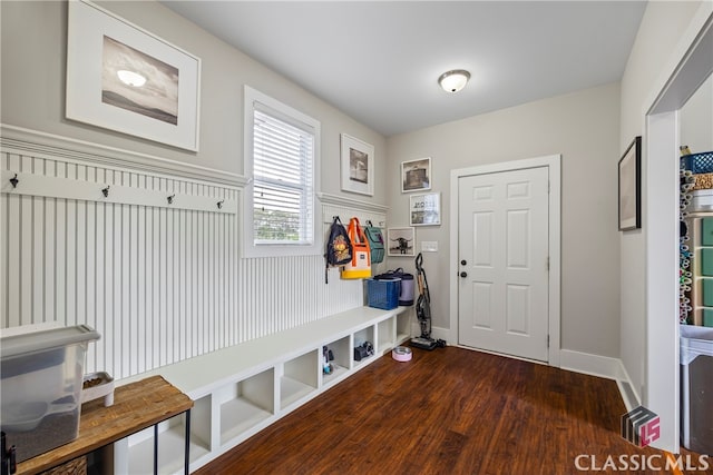 mudroom with dark wood-type flooring and baseboards