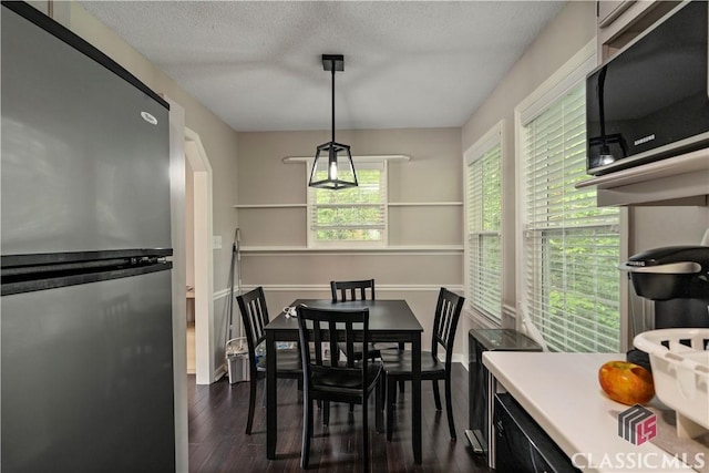 255 Pine Valley Dr, Athens, GA 30606 - dining area with dark wood-style flooring and a textured ceiling