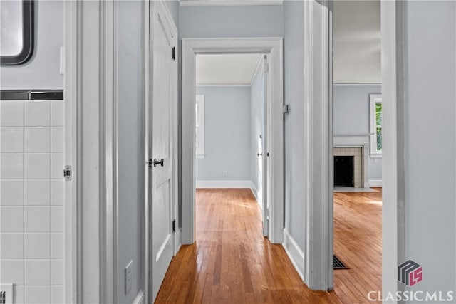 120 Mathews Ave, Athens, GA 30606 - hallway featuring crown molding, hardwood / wood-style floors, and baseboards