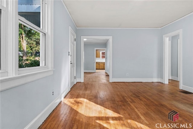 120 Mathews Ave, Athens, GA 30606 - unfurnished room with hardwood / wood-style flooring, crown molding, and baseboards