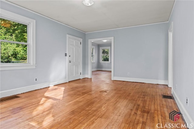 120 Mathews Ave, Athens, GA 30606 - spare room featuring crown molding, light wood-type flooring, and baseboards