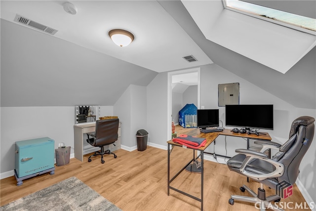 office area featuring wood finished floors, electric panel, lofted ceiling, and baseboards