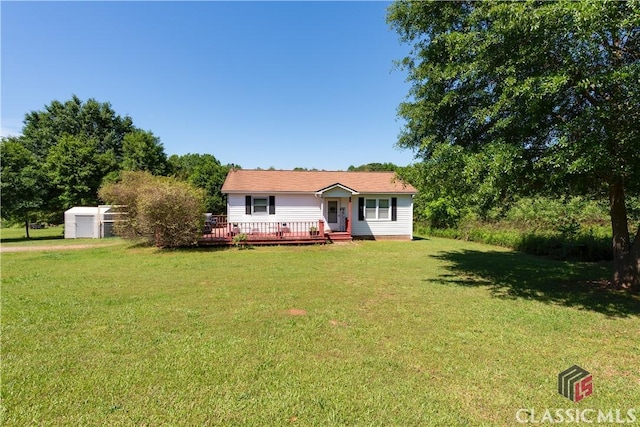 35 Good Hope Rd, Colbert, GA 30628 - view of front facade featuring a front yard, a deck, and an outdoor structure