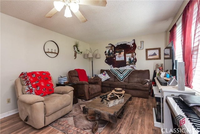 35 Good Hope Rd, Colbert, GA 30628 - living area with wood finished floors, a ceiling fan, a textured ceiling, and baseboards
