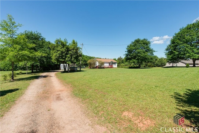 35 Good Hope Rd, Colbert, GA 30628 - view of front facade with driveway and a front yard