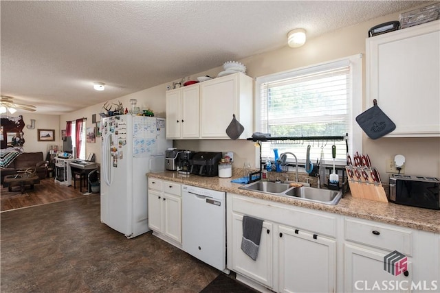 35 Good Hope Rd, Colbert, GA 30628 - kitchen with white appliances, a sink, a textured ceiling, white cabinets, and light countertops