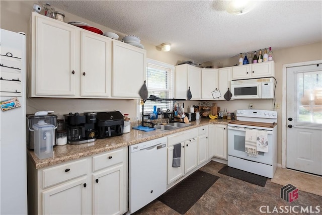 35 Good Hope Rd, Colbert, GA 30628 - kitchen featuring white appliances, a sink, healthy amount of natural light, white cabinetry, and a textured ceiling