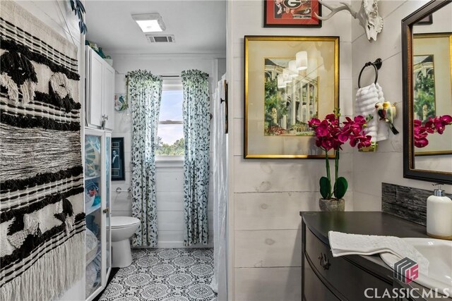 3081 Macedonia Rd, Union Point, GA 30669 - bathroom featuring tile patterned flooring, vanity, and toilet