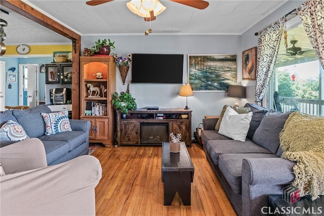3081 Macedonia Rd, Union Point, GA 30669 - living area featuring a ceiling fan, ornamental molding, and wood finished floors