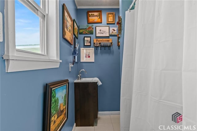3081 Macedonia Rd, Union Point, GA 30669 - full bathroom with tile patterned floors, a sink, crown molding, curtained shower, and baseboards