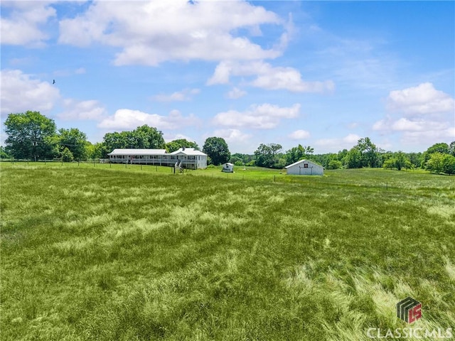 3081 Macedonia Rd, Union Point, GA 30669 - view of grassy yard with a view of countryside and an outbuilding