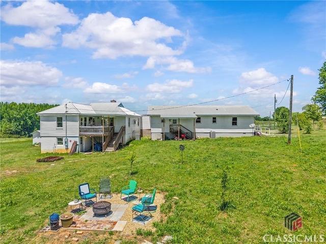 3081 Macedonia Rd, Union Point, GA 30669 - back of house with an outdoor fire pit, stairs, a lawn, a wooden deck, and a patio area