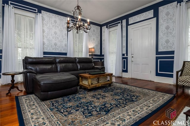 172 N Second St, Madison, GA 30650 - living area featuring wallpapered walls, ornamental molding, a chandelier, and wood finished floors