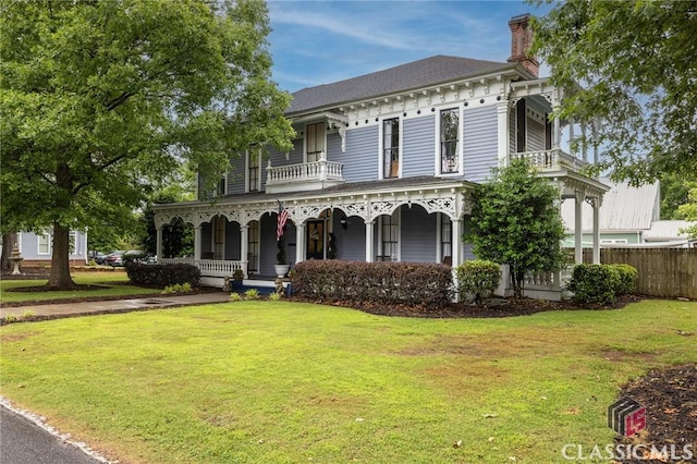 172 N Second St, Madison, GA 30650 - italianate home with a chimney, covered porch, and a balcony