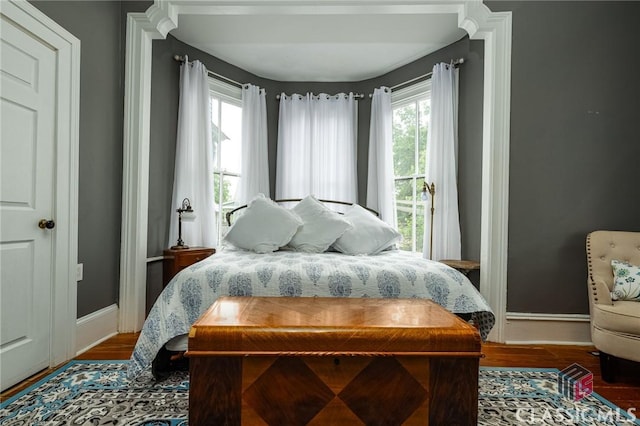 172 N Second St, Madison, GA 30650 - bedroom with baseboards and wood finished floors