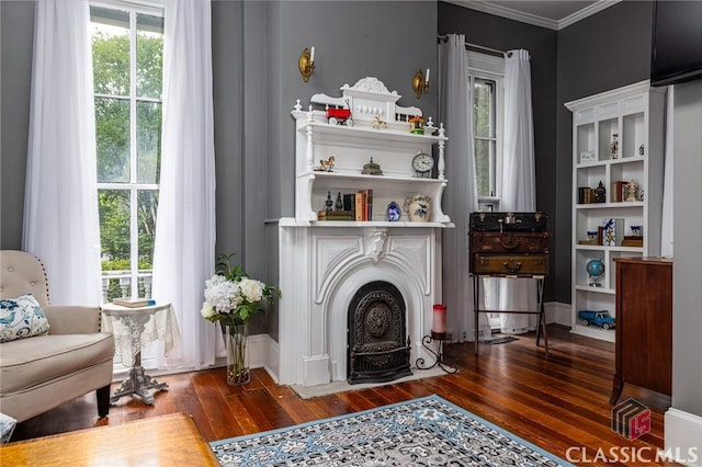172 N Second St, Madison, GA 30650 - sitting room featuring hardwood / wood-style floors, ornamental molding, baseboards, and a fireplace with flush hearth