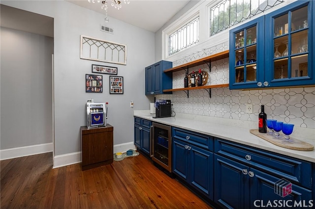 172 N Second St, Madison, GA 30650 - bar area with wine cooler, backsplash, dark wood finished floors, and baseboards