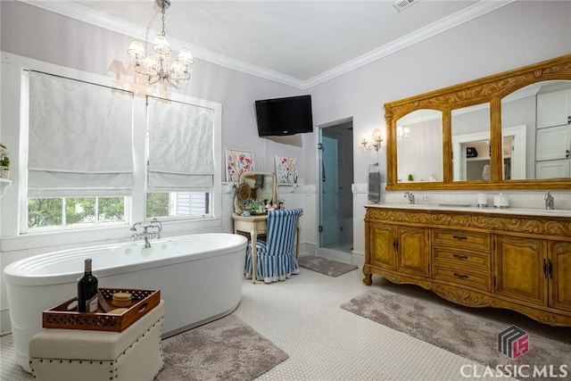 172 N Second St, Madison, GA 30650 - bathroom featuring crown molding, a shower stall, a chandelier, a soaking tub, and double vanity