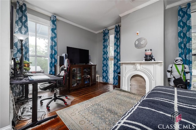 172 N Second St, Madison, GA 30650 - living area featuring wood finished floors, crown molding, plenty of natural light, an office area, and baseboards