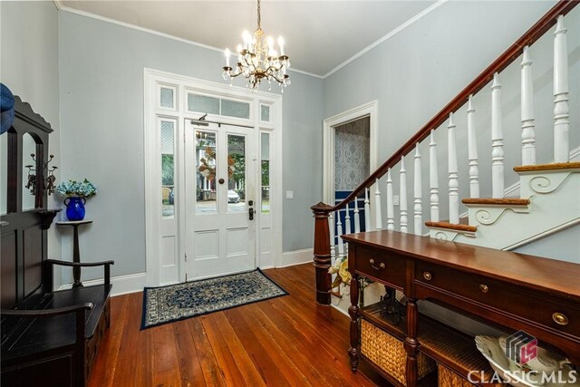 172 N Second St, Madison, GA 30650 - entrance foyer with stairway, hardwood / wood-style flooring, a chandelier, baseboards, and crown molding