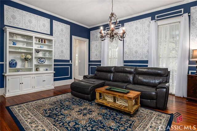 172 N Second St, Madison, GA 30650 - living area with a chandelier, dark wood-style floors, wainscoting, crown molding, and wallpapered walls