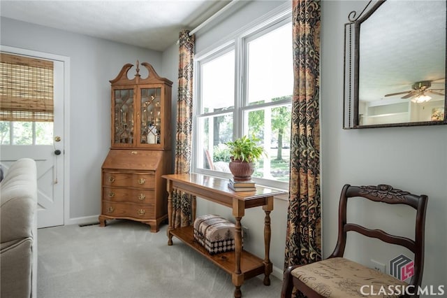 1181 Pete Dickens Rd, Bogart, GA 30622 - living area with carpet, a ceiling fan, and baseboards