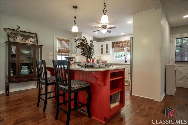 1181 Pete Dickens Rd, Bogart, GA 30622 - kitchen featuring open shelves, white cabinetry, dark wood-style flooring, ceiling fan, and healthy amount of natural light