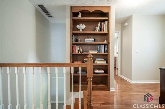1181 Pete Dickens Rd, Bogart, GA 30622 - hallway featuring wood finished floors and baseboards