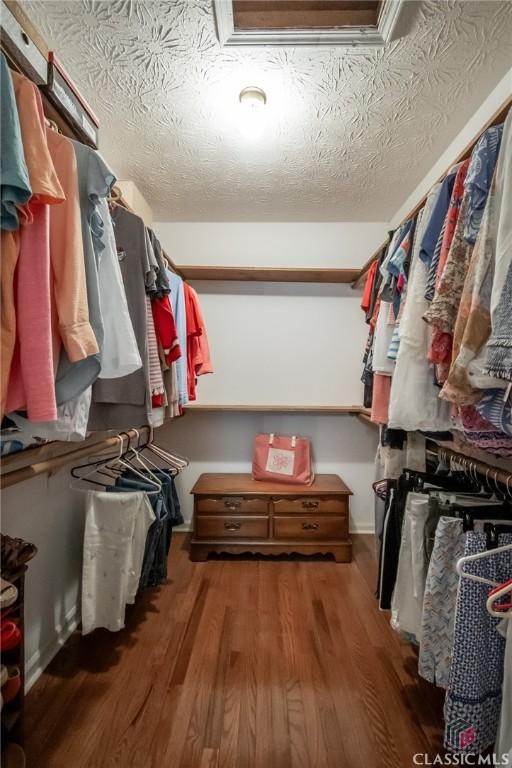 1181 Pete Dickens Rd, Bogart, GA 30622 - walk in closet featuring wood finished floors