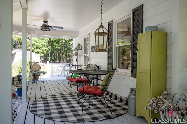 1181 Pete Dickens Rd, Bogart, GA 30622 - wooden deck with outdoor dining area and ceiling fan