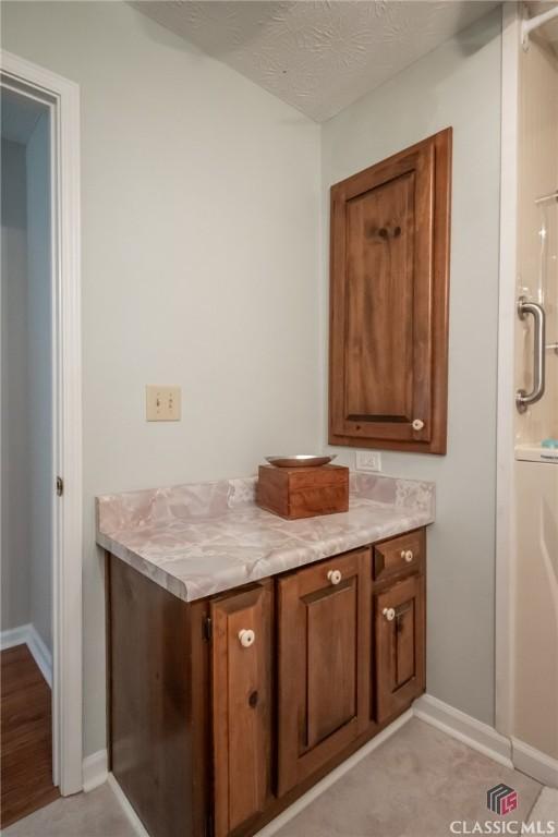 1181 Pete Dickens Rd, Bogart, GA 30622 - miscellaneous room featuring wood finished floors, baseboards, and ceiling fan