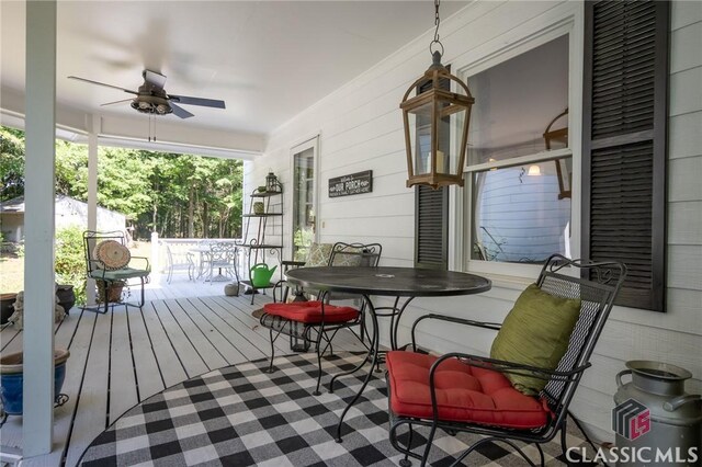 1181 Pete Dickens Rd, Bogart, GA 30622 - wooden deck featuring a ceiling fan and outdoor dining area