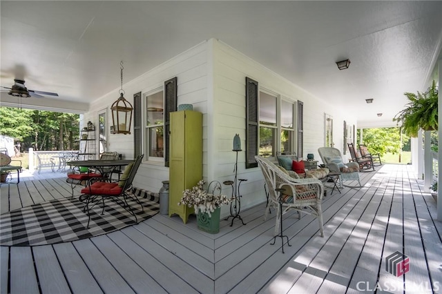 1181 Pete Dickens Rd, Bogart, GA 30622 - porch with outdoor dining space and a ceiling fan