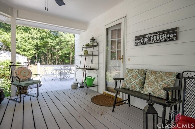 1181 Pete Dickens Rd, Bogart, GA 30622 - wooden deck featuring ceiling fan and outdoor dining area