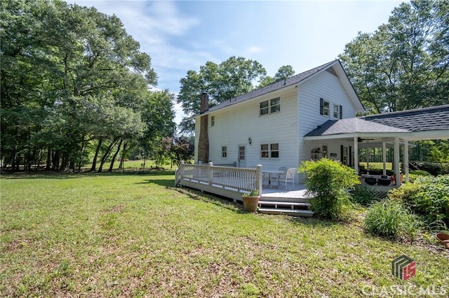 1181 Pete Dickens Rd, Bogart, GA 30622 - rear view of property with a lawn, a chimney, a wooden deck, and roof with shingles